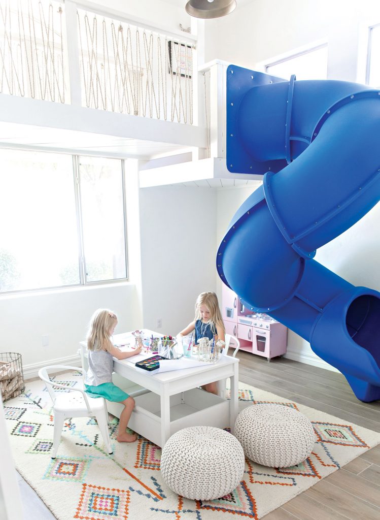 ELECTRIC SLIDE Interior Designer: Kristen Forgione Installing an indoor slide was no easy feat, but a Scottsdale father knew it would be the perfect addition for his two little girls. “They love to read, play, hide and craft,” Forgione says. “The dad wanted a slide so that all kids from the neighborhood would feel welcome but also for the girls to feel feminine and at home when it was just them.” The Phoenix-based designer embraced the room’s high ceilings by adding a loft area accessible by ladder. To contrast the bright blue slide, she adorned the space with airy, modern appointments, paired with her signature aesthetic: crisp white and wood tones, layers of texture and patterns and fanciful notes of color. A Murphy bed and crafting area added an extra bit of utility. “I don’t know if the dad or the girls loved it more,” Forgione says. “But the space is still a neighborhood favorite—it brings kids of all ages together, especially during those hot summer months.”