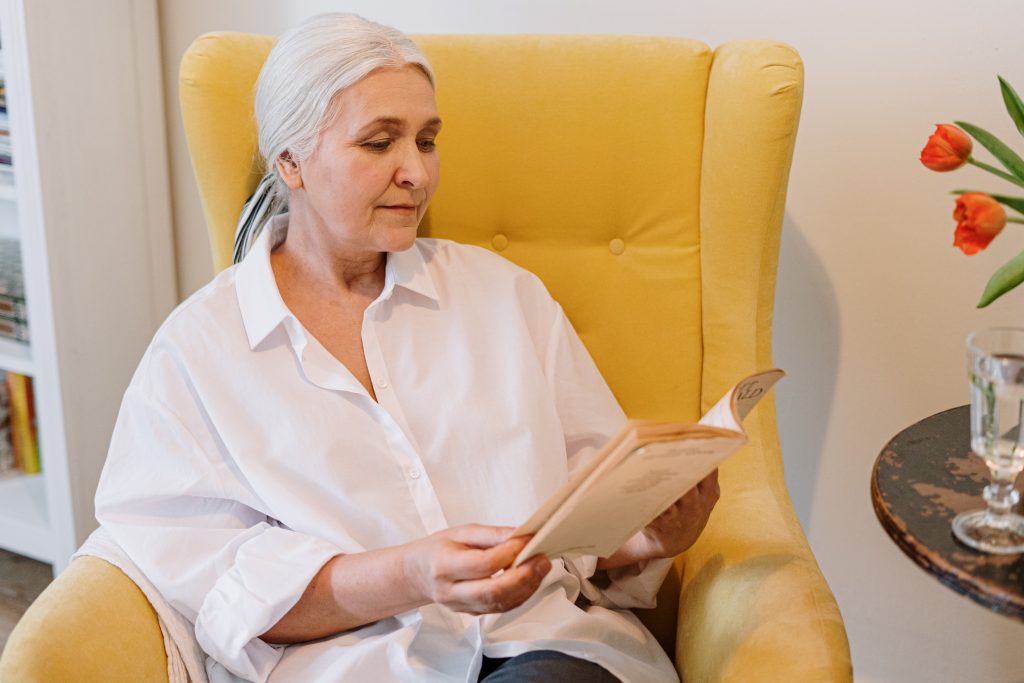 Older woman reading a book