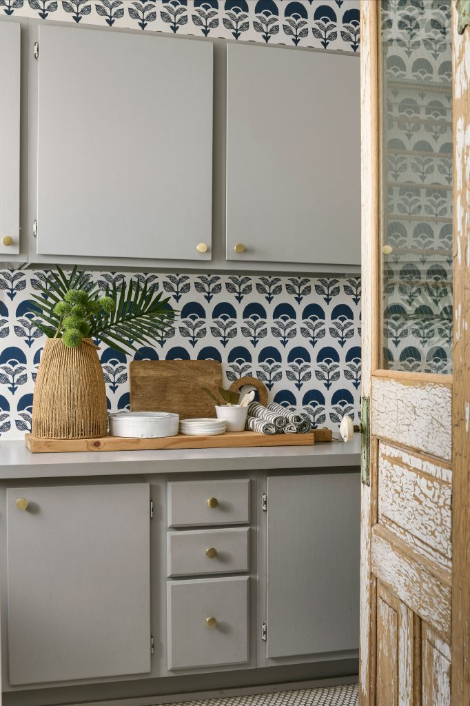 Wallpaper used as a backsplash for cabinetry