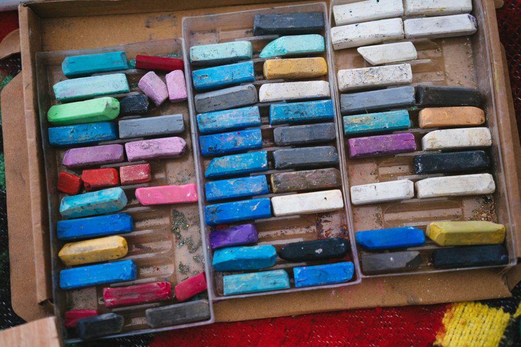 A box of chalk in varying colors