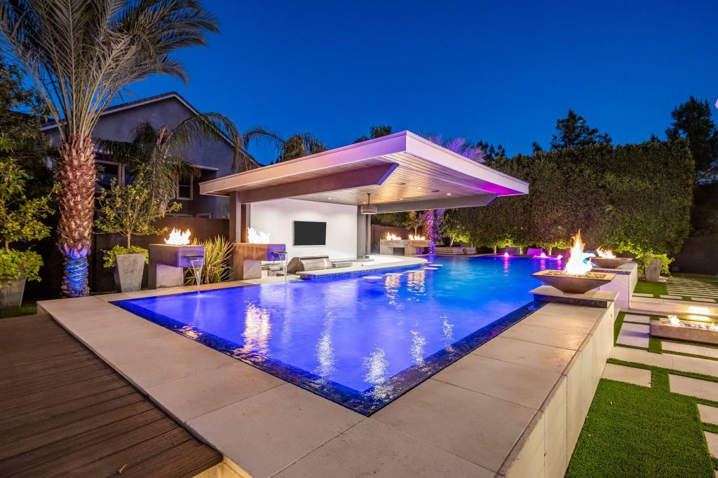 An infinity pool glowing at night