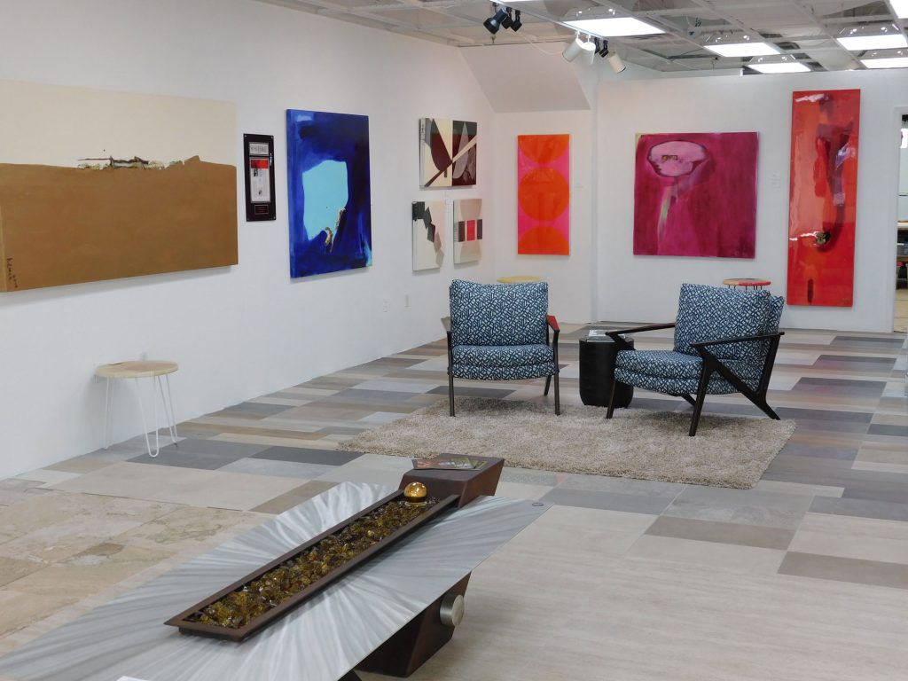 Paintings on white walls of a gallery
