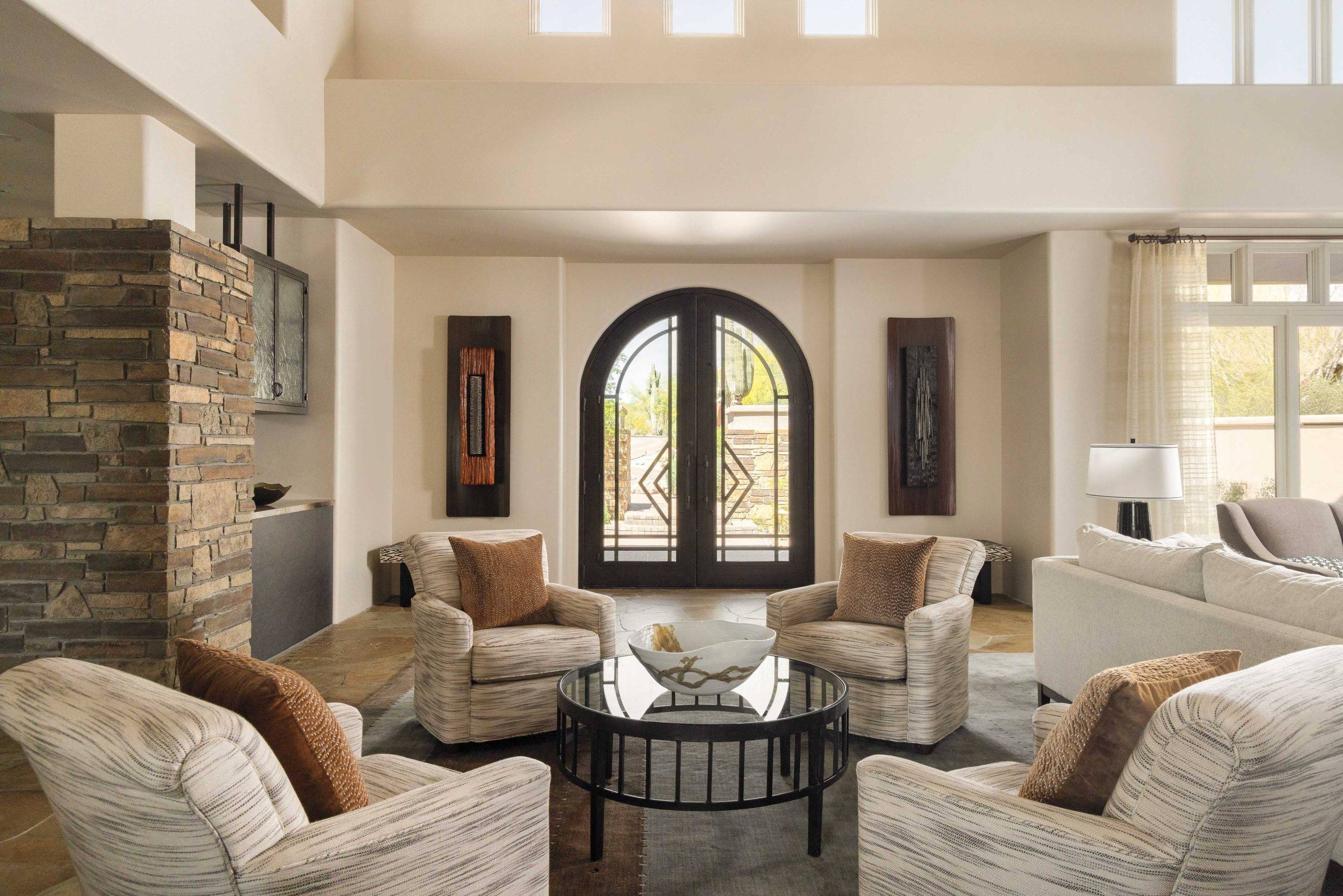 The arched, leaded glass front door is original and timeless, and allows natural light to flood the entry and living room.
