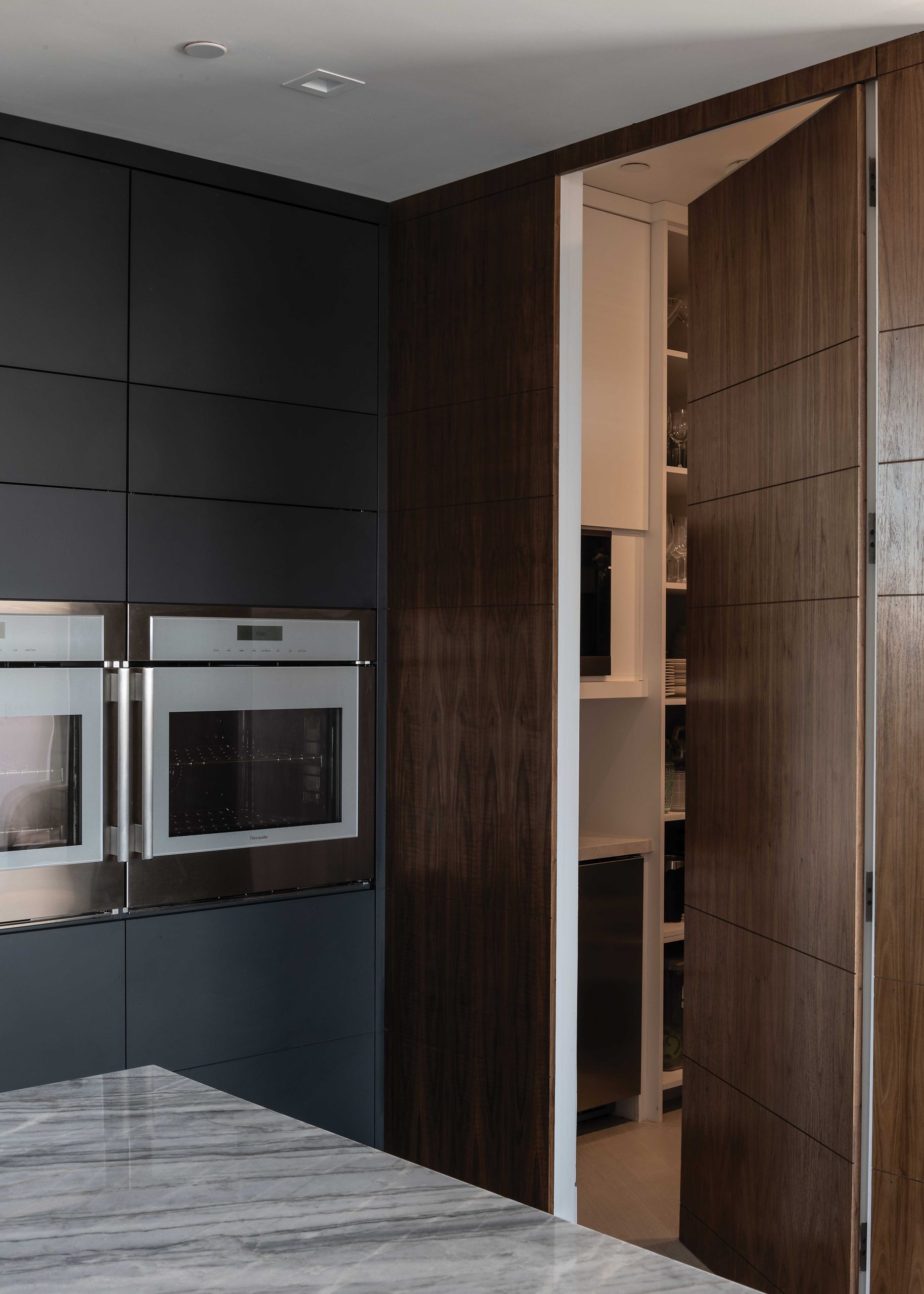 The breakfast nook’s floor-to-ceiling doors open to the morning air. “I like cantilevers and very thin overhangs in my architecture,” Tsontakis says. “They’re very important here in the desert for shade and protection.”