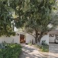 Bob and Helen Winkel purchased their 1953 home in Phoenix’s desirable Marlen Grove neighborhood in 1980. The house, which was designed by Ralph Haver and features a south-facing yard and large walled courtyard, had been owned by a graphic designer who added the large street numbers to the facade. The couple hired architect Wendell Burnette to update the home, which had remained relatively untouched since it was built. His thoughtful modernizations and addition complement Haver’s original vision and do not affect the structure’s midcentury curb appeal. Bob bought the silver Jaguar, also from 1953, as a high school graduation gift to himself.